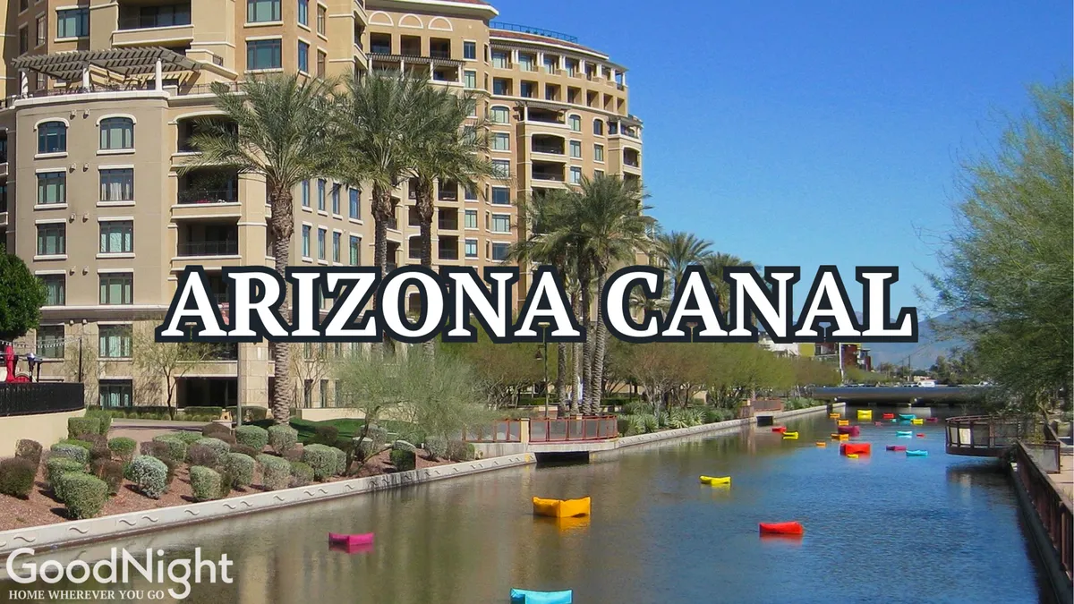 This image captures the Arizona Canal, featuring colorful boats, palm trees, and modern buildings lining the waterfront. The energetic setting highlights the canal as a destination for walking, boating, and leisure activities.